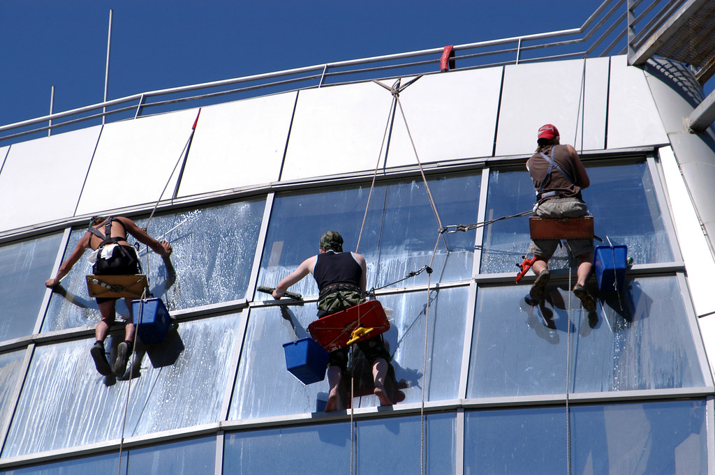 Picture of window washers with squeegee blades and scrubbing bubbles